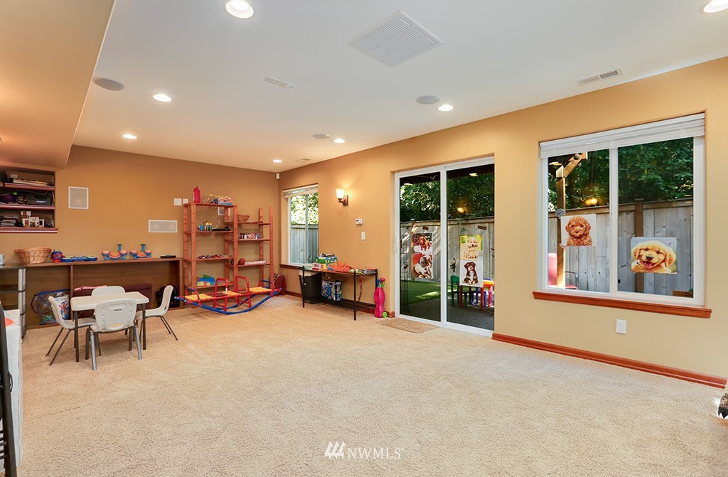 17801 20th Avenue Southeast Bothell, WA 98012 - Photo 19 of 25 an empty room with furniture water view and a large window