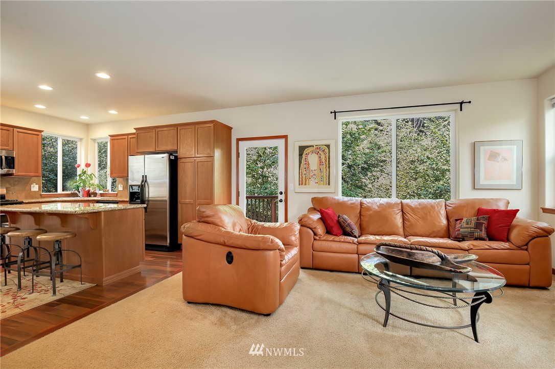 17801 20th Avenue Southeast Bothell, WA 98012 - Photo 3 of 25 a living room with furniture and a large window