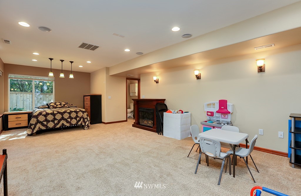 17801 20th Avenue Southeast Bothell, WA 98012 - Photo 21 of 25 a living room with furniture and a flat screen tv