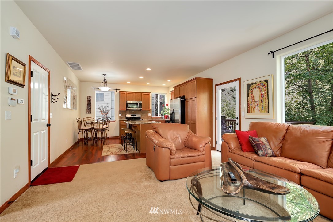 17801 20th Avenue Southeast Bothell, WA 98012 - Photo 8 of 25 a living room with furniture and a large window