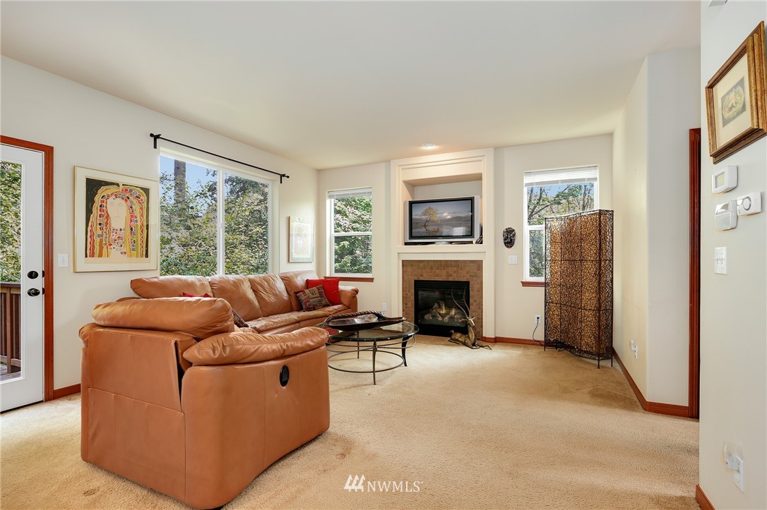 17801 20th Avenue Southeast Bothell, WA 98012 - Photo 9 of 25 a living room with furniture and a fireplace