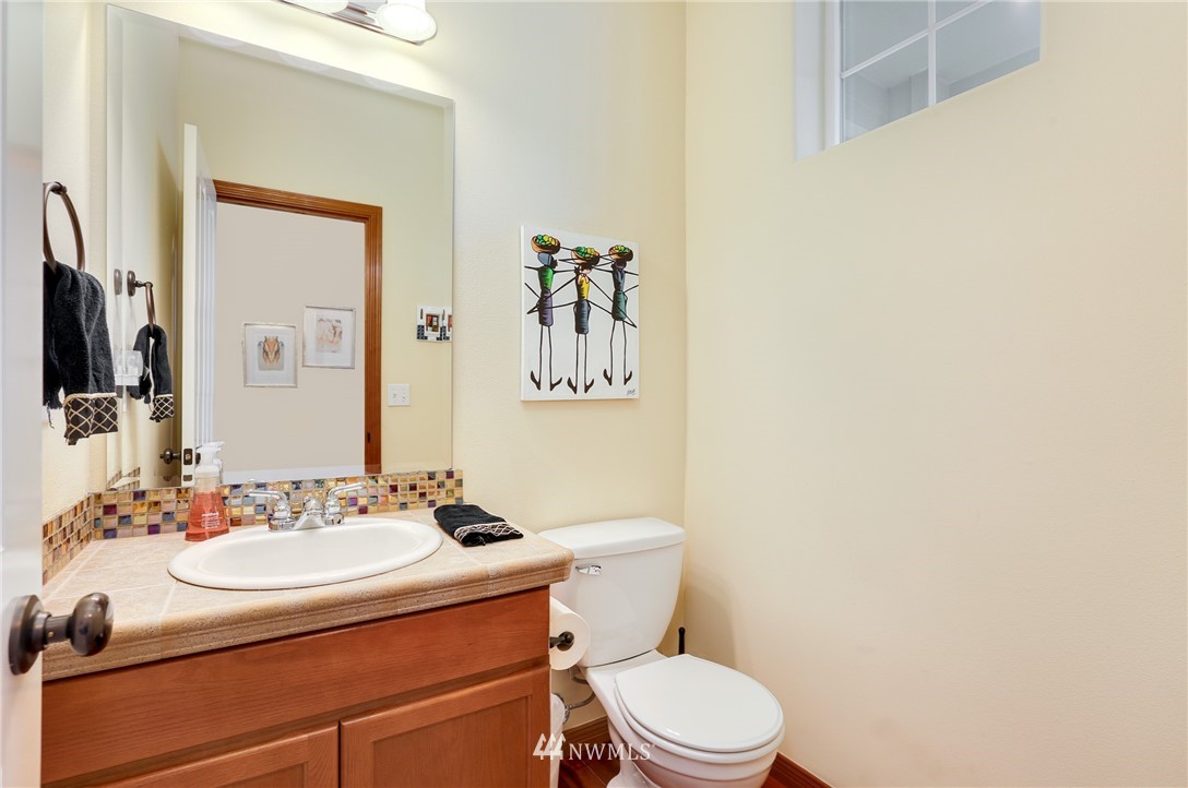 17801 20th Avenue Southeast Bothell, WA 98012 - Photo 10 of 25 a bathroom with a sink mirror vanity and toilet
