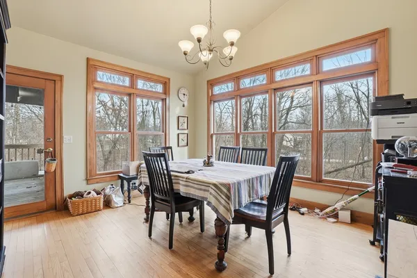 a kitchen with stainless steel appliances and chandelier