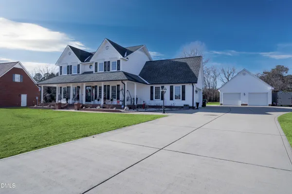 a view of a kitchen with a sink and wooden floor