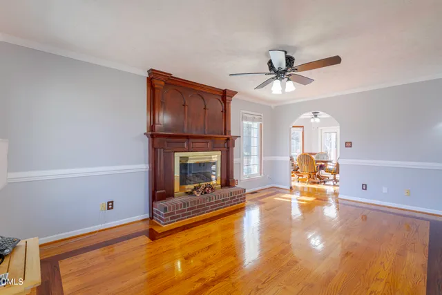 a kitchen with stainless steel appliances granite countertop wooden cabinets a stove a sink and a counter space