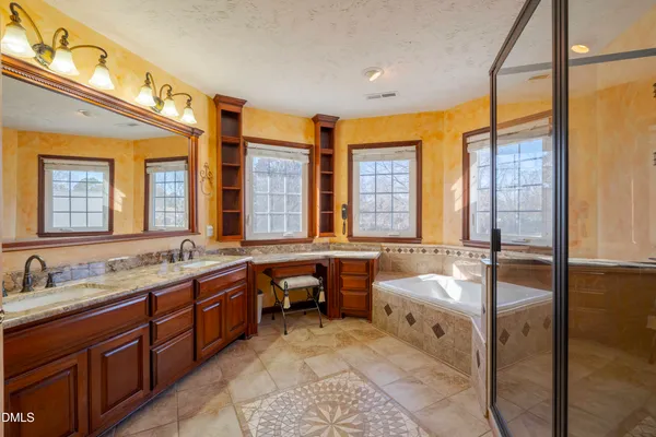 a front view of a house with swimming pool having outdoor seating