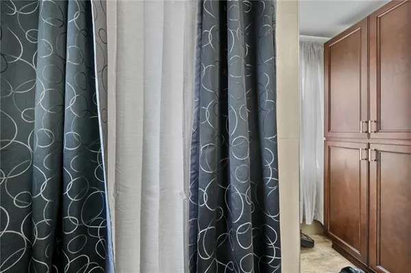 walk in closet with wooden floor