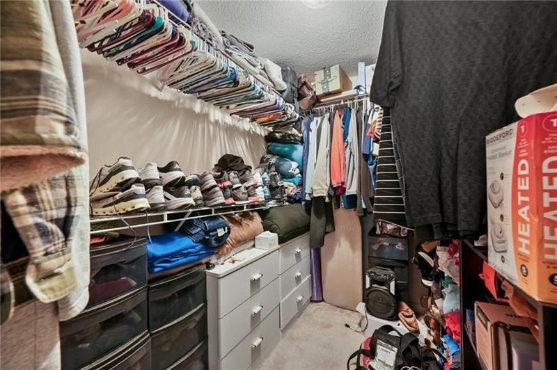 5303 Meadows Lake Crossing Southwest Powder Springs, GA 30127 - Photo 14 of 53 walk in closet with wooden floor
