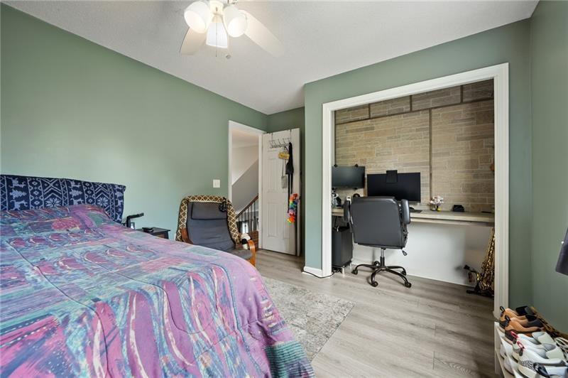 5303 Meadows Lake Crossing Southwest Powder Springs, GA 30127 - Photo 19 of 53 a bedroom with a bed a desk and chair