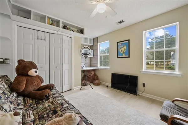 a bed room with a bed and a window