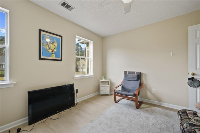 5303 Meadows Lake Crossing Southwest Powder Springs, GA 30127 - Photo 22 of 53 a living room with furniture and a window