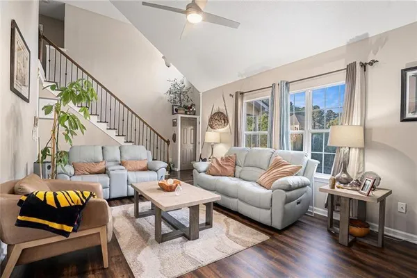 a living room with furniture and a table