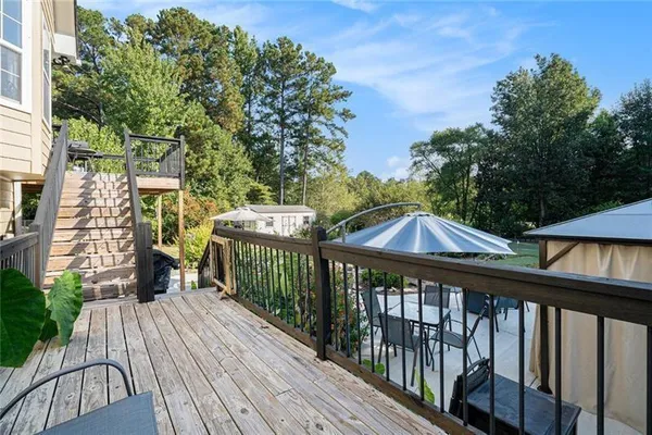 an outdoor space with furniture and umbrella