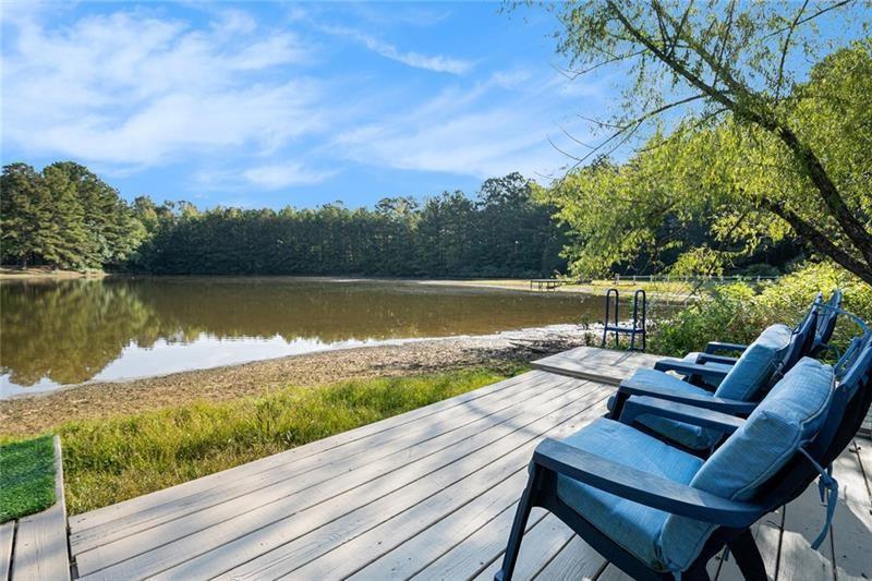 5303 Meadows Lake Crossing Southwest Powder Springs, GA 30127 - Photo 36 of 53 a view of swimming pool with lake view and mountain view