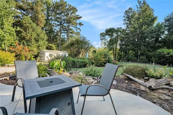 an outdoor space with patio and outdoor seating