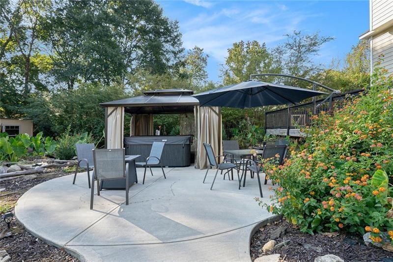 5303 Meadows Lake Crossing Southwest Powder Springs, GA 30127 - Photo 39 of 53 an outdoor space with patio and outdoor seating