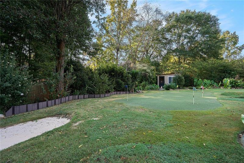 5303 Meadows Lake Crossing Southwest Powder Springs, GA 30127 - Photo 48 of 53 a view of a backyard with a garden