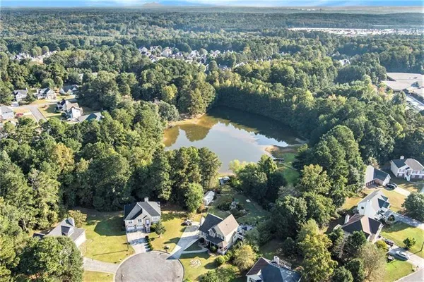 an aerial view of a house with a yard