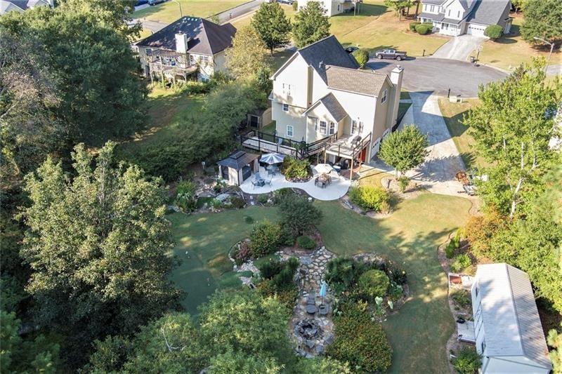 5303 Meadows Lake Crossing Southwest Powder Springs, GA 30127 - Photo 51 of 53 an aerial view of residential houses with outdoor space and trees