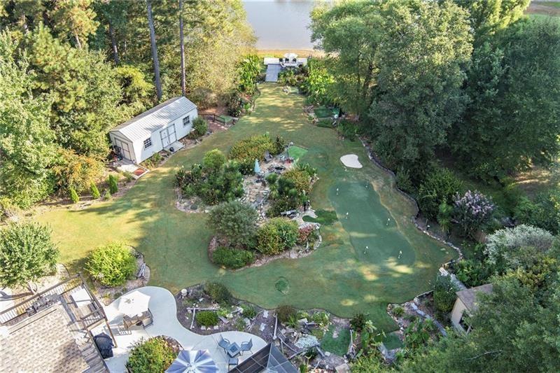 5303 Meadows Lake Crossing Southwest Powder Springs, GA 30127 - Photo 52 of 53 an aerial view of a house with a yard