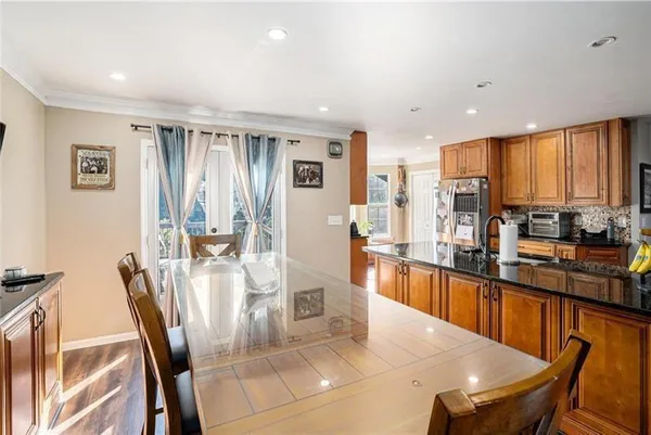a view of a dining room with furniture window and outside view