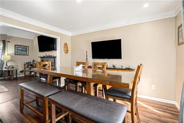 a view of a livingroom with furniture and a flat screen tv