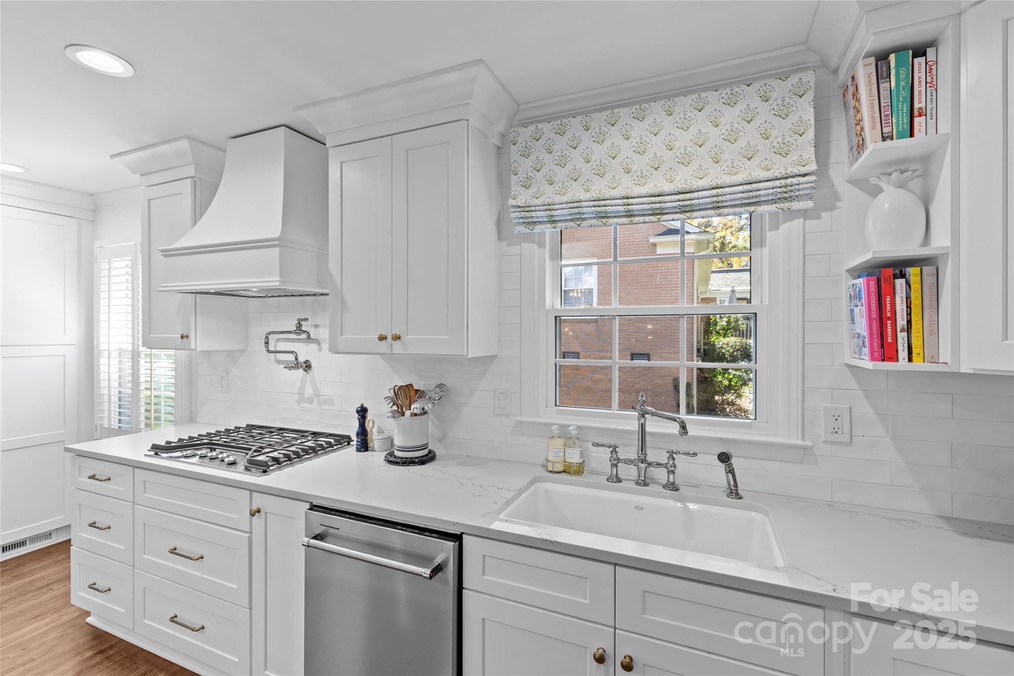 7526 Whistlestop Road Charlotte, NC 28210 - Photo 18 of 42 a kitchen with stainless steel appliances cabinets a large window and a sink