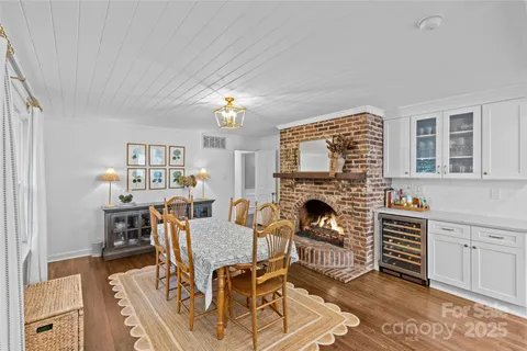 a view of a livingroom with furniture and a fireplace