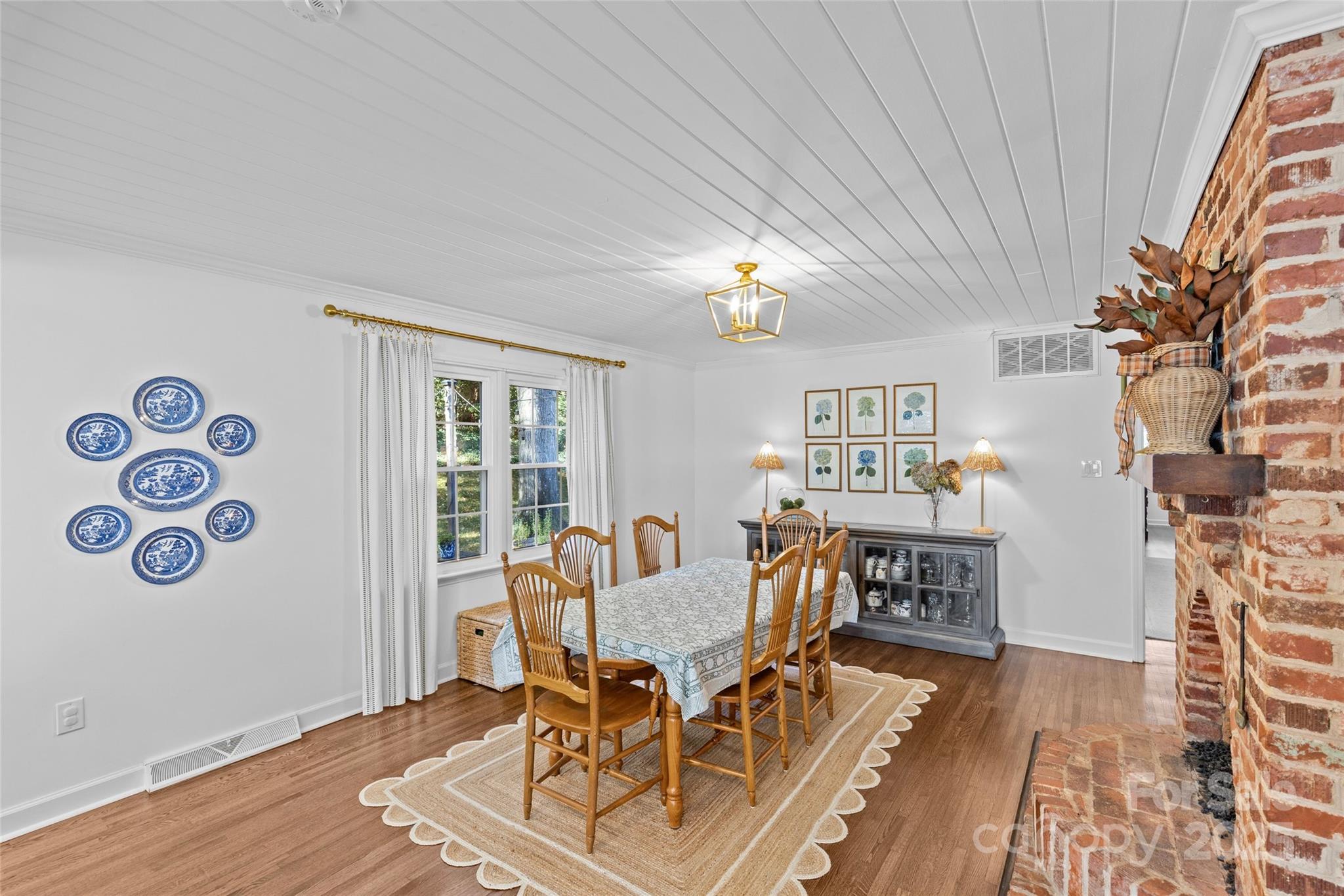 7526 Whistlestop Road Charlotte, NC 28210 - Photo 21 of 42 a view of a dining room with furniture window and wooden floor