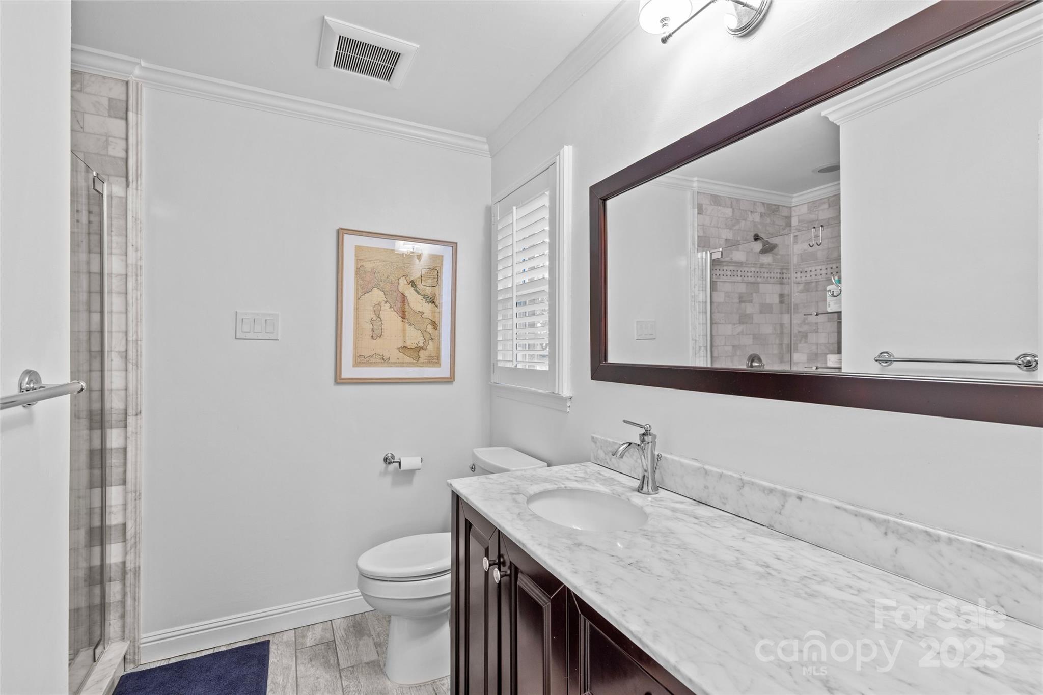 7526 Whistlestop Road Charlotte, NC 28210 - Photo 27 of 42 a bathroom with a granite countertop sink a toilet and a mirror