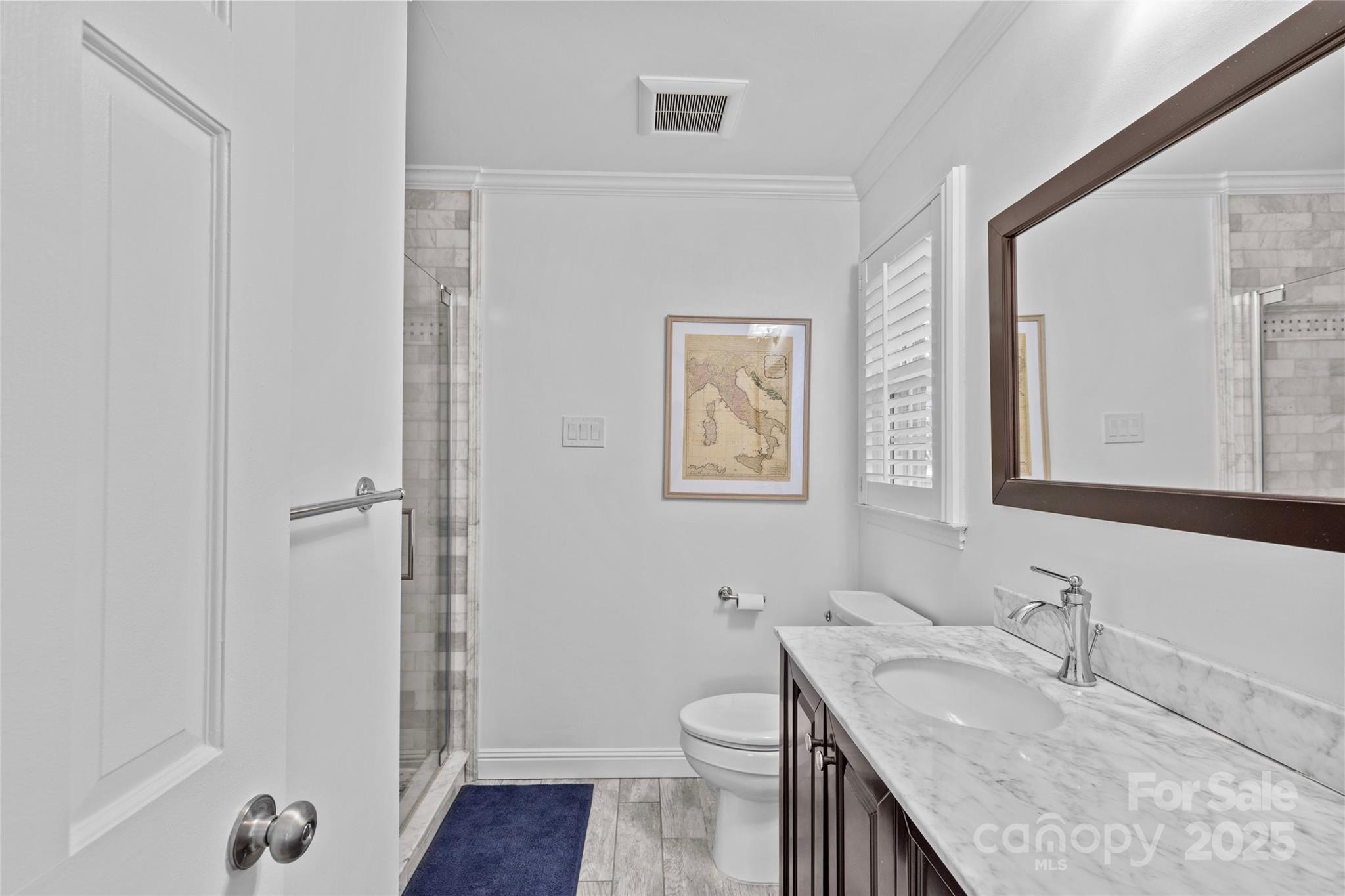 7526 Whistlestop Road Charlotte, NC 28210 - Photo 28 of 42 a bathroom with a granite countertop sink toilet and shower