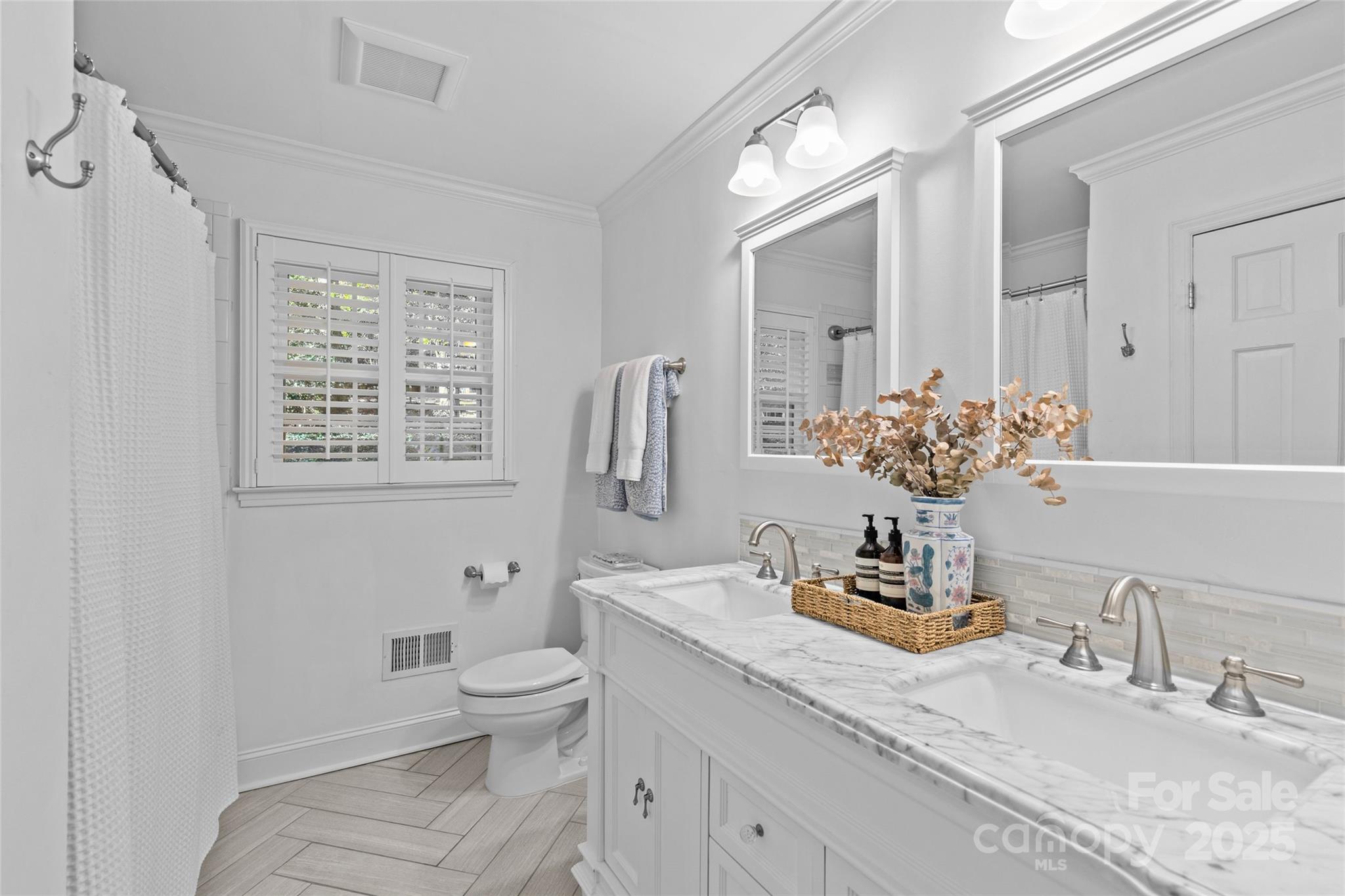 7526 Whistlestop Road Charlotte, NC 28210 - Photo 32 of 42 a bathroom with a granite countertop sink a toilet and a large mirror