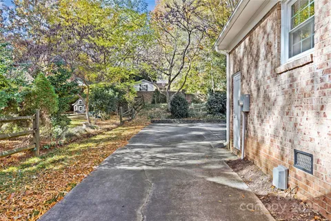 a view of yard with large trees