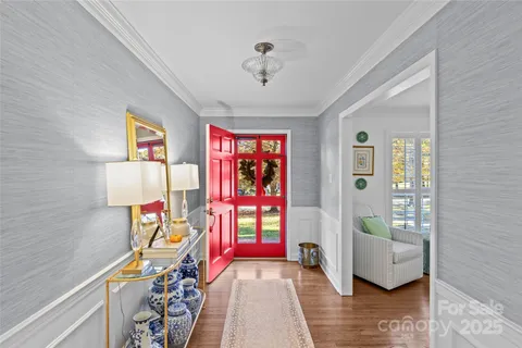 a view of an entryway with wooden floor