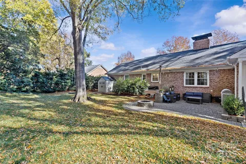 a view of a house with backyard porch and sitting area