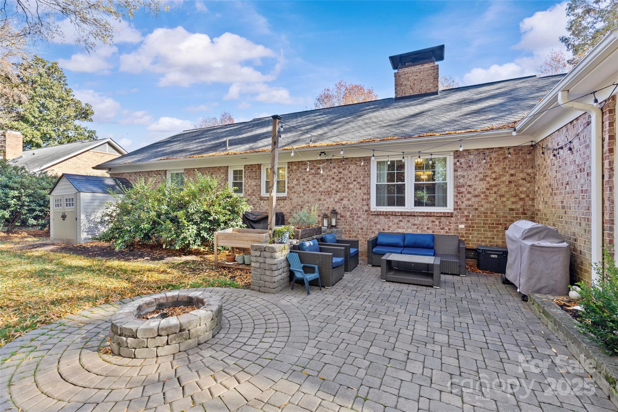7526 Whistlestop Road Charlotte, NC 28210 - Photo 42 of 42 a view of a patio with couches table and chairs and potted plants