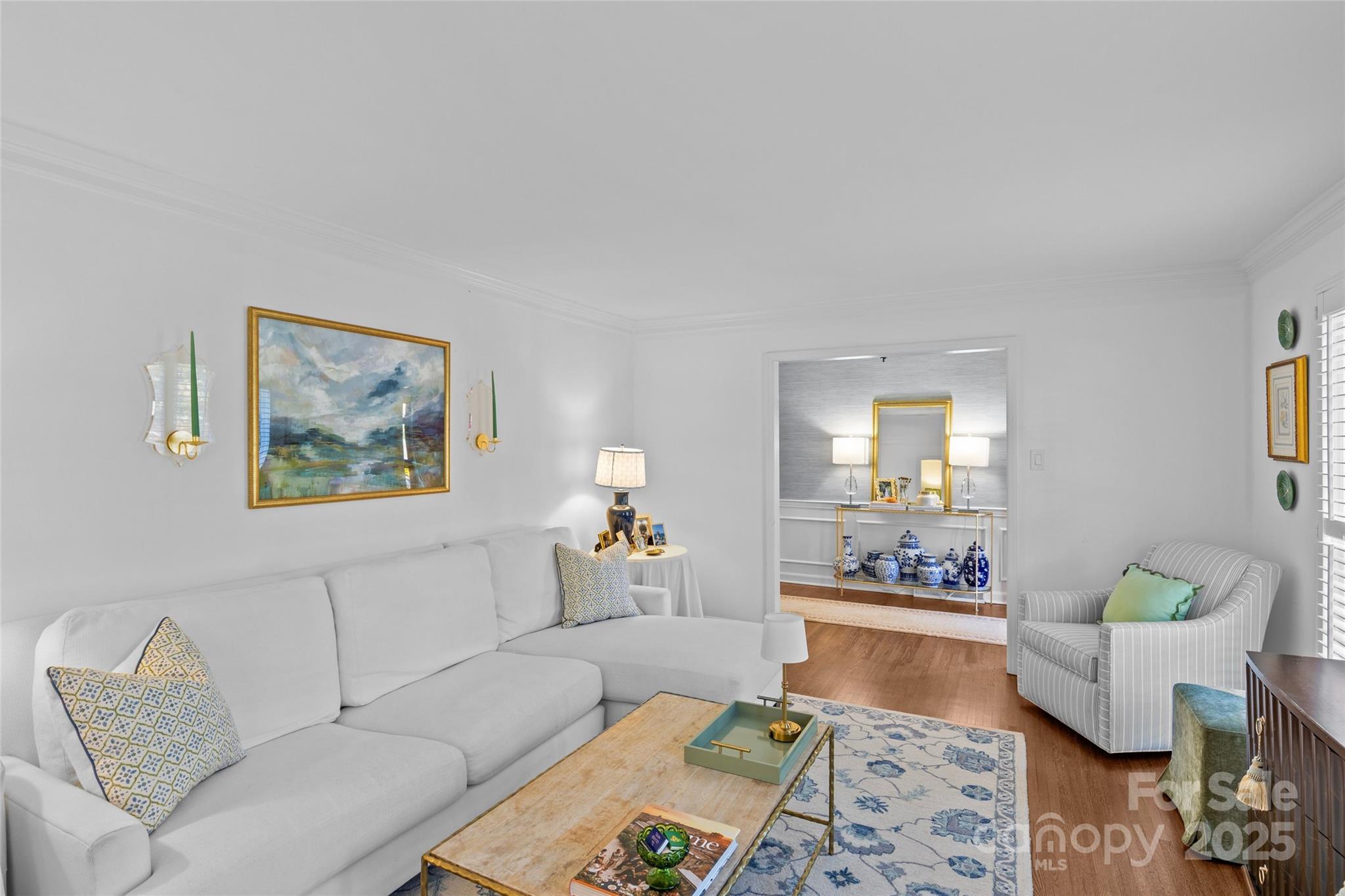 7526 Whistlestop Road Charlotte, NC 28210 - Photo 7 of 42 a living room with furniture and a painting on the wall