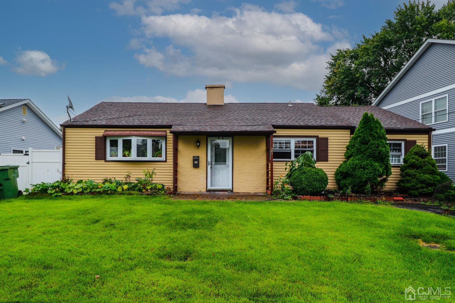 23 Matson Road Edison, NJ 08817 - Photo 1 of 28 a front view of a house with a garden