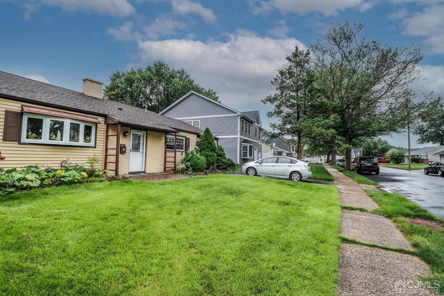 23 Matson Road Edison, NJ 08817 - Photo 2 of 28 a front view of a house with a yard