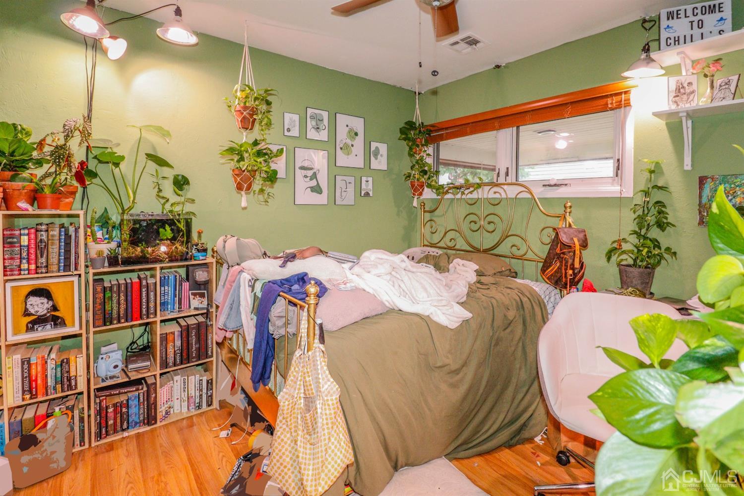 23 Matson Road Edison, NJ 08817 - Photo 14 of 28 a bed room with a bed window and book shelf
