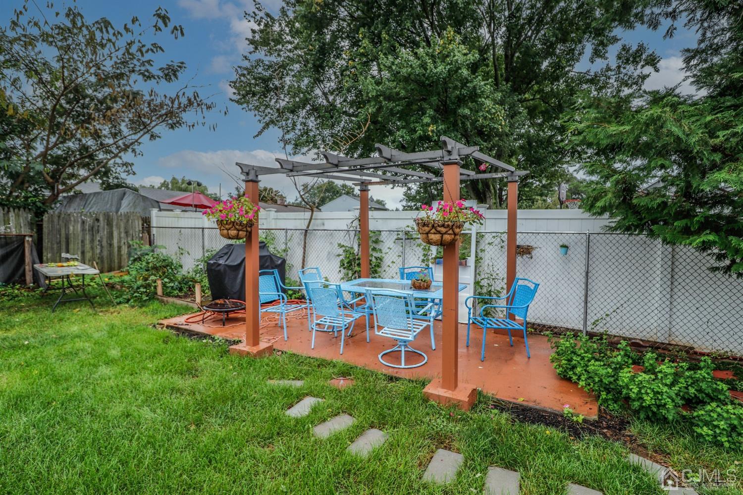 23 Matson Road Edison, NJ 08817 - Photo 21 of 28 a view of yard with swimming pool and trees in the background