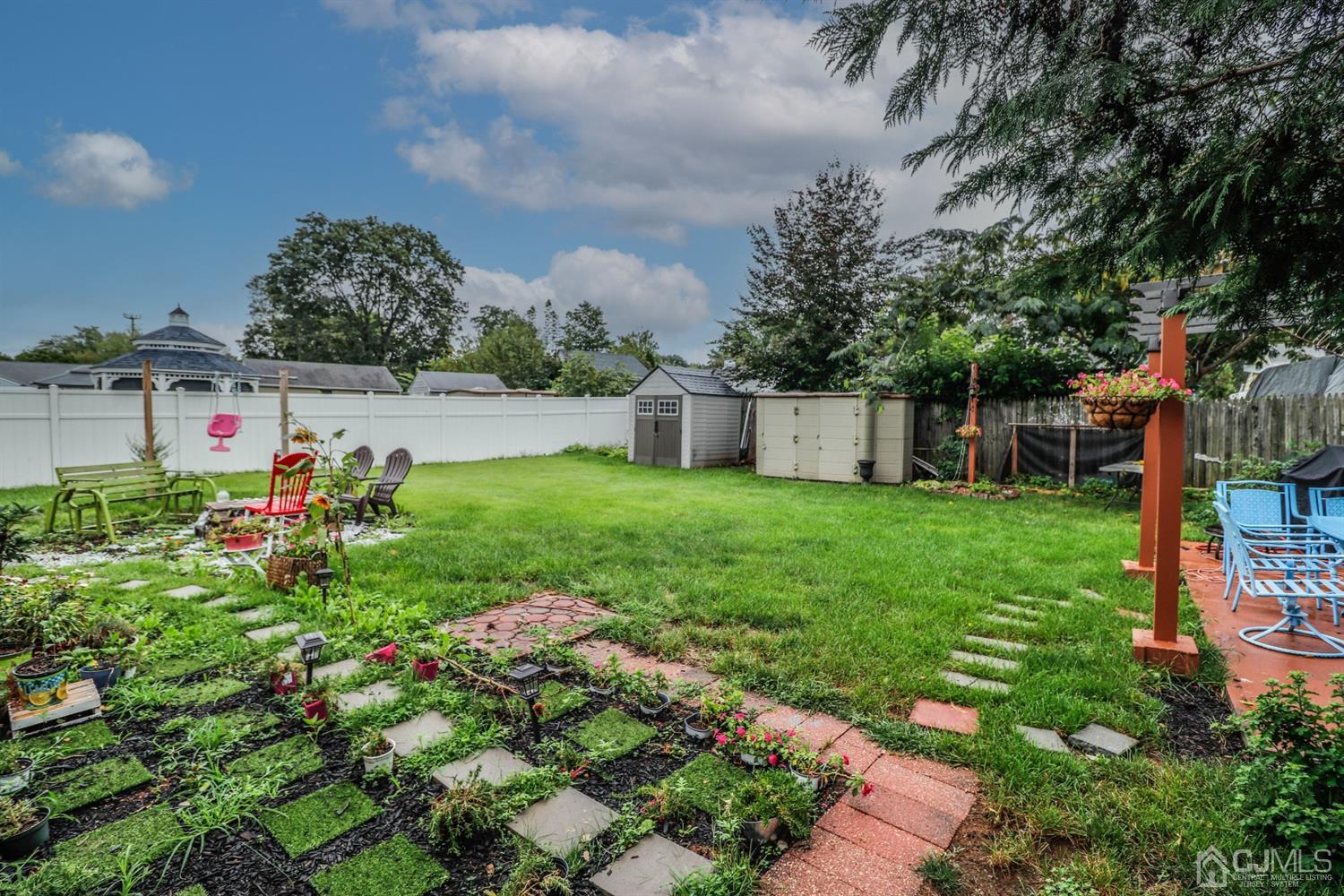 23 Matson Road Edison, NJ 08817 - Photo 22 of 28 a view of a house with a yard and sitting area