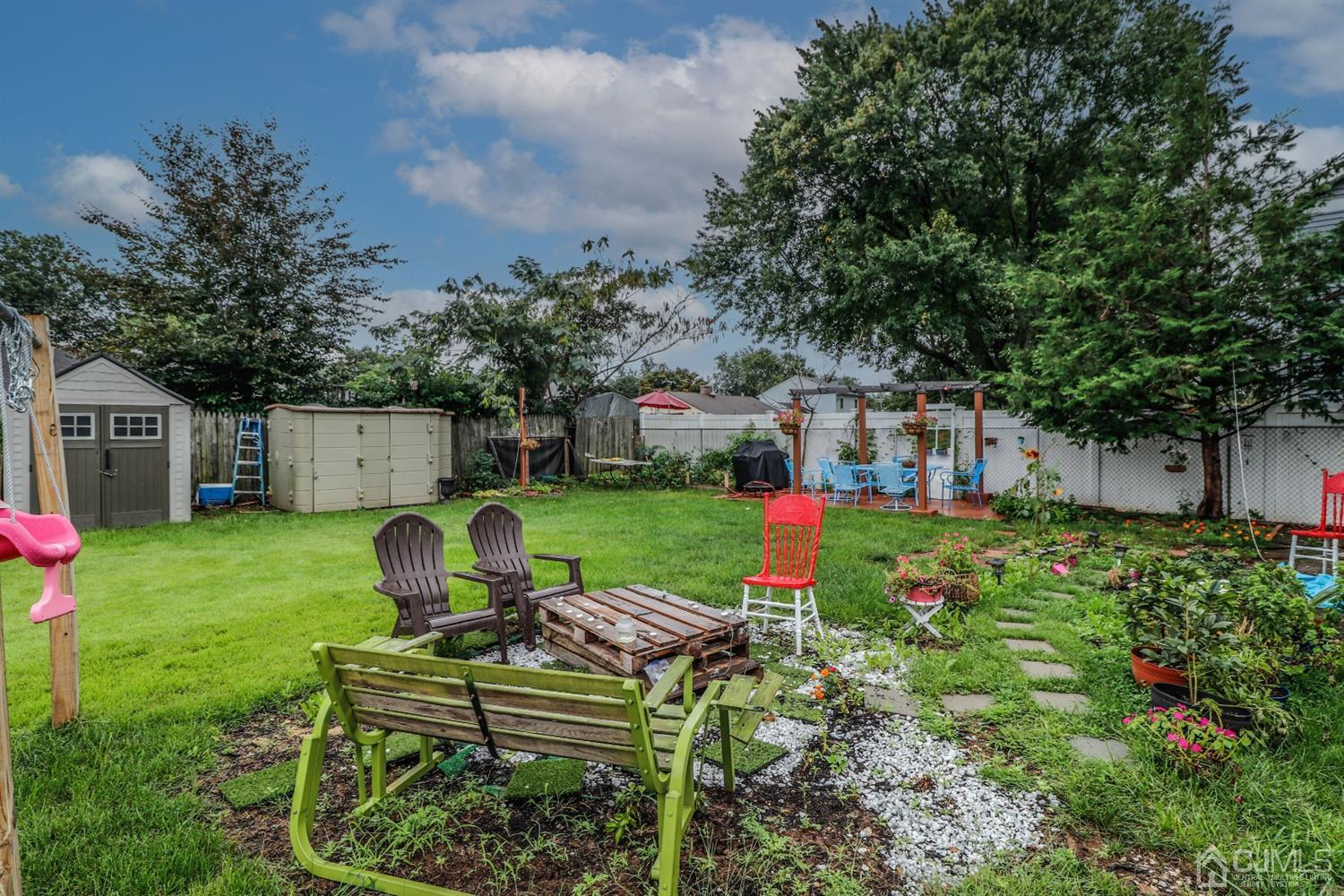 23 Matson Road Edison, NJ 08817 - Photo 27 of 28 a view of a house with backyard sitting area and garden