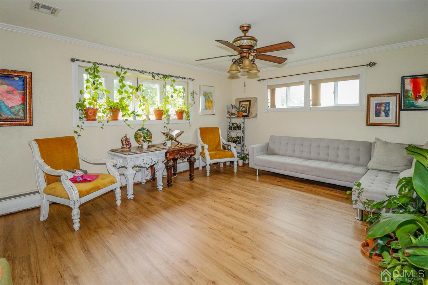 23 Matson Road Edison, NJ 08817 - Photo 7 of 28 a living room with furniture and a wooden floor