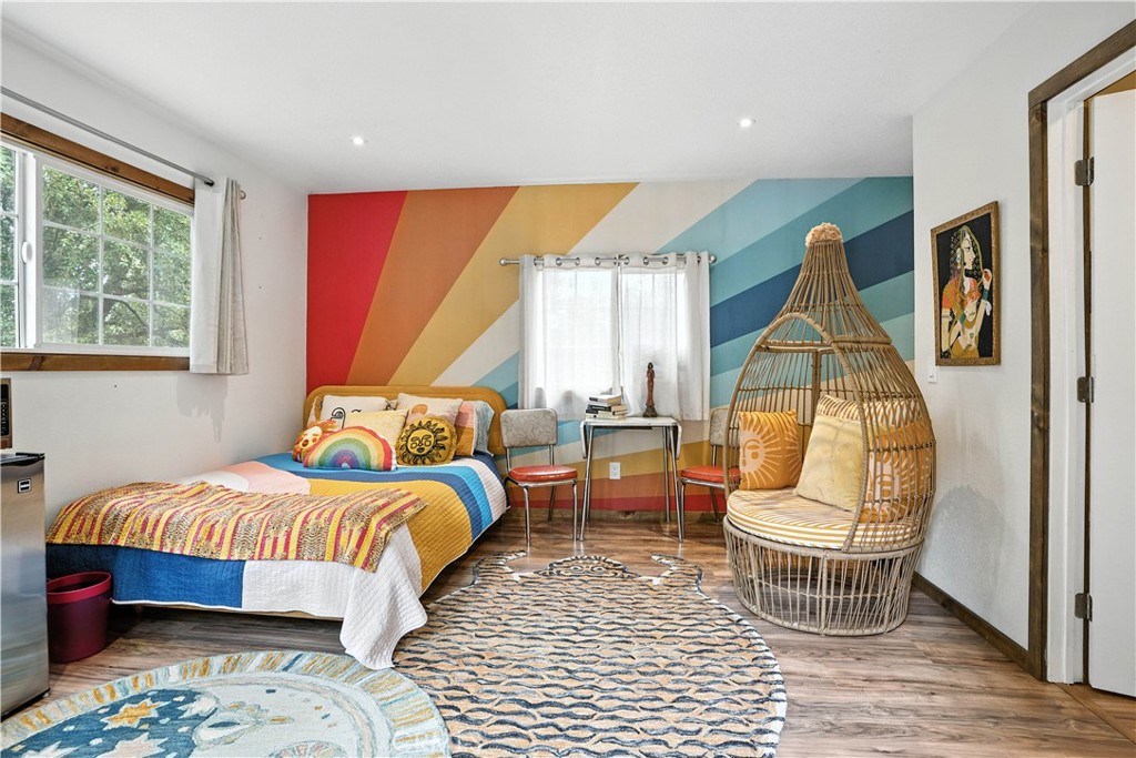 24990 Marion Ridge Drive Idyllwild, CA 92549 - Photo 20 of 41 a bedroom with a bed and wooden floor