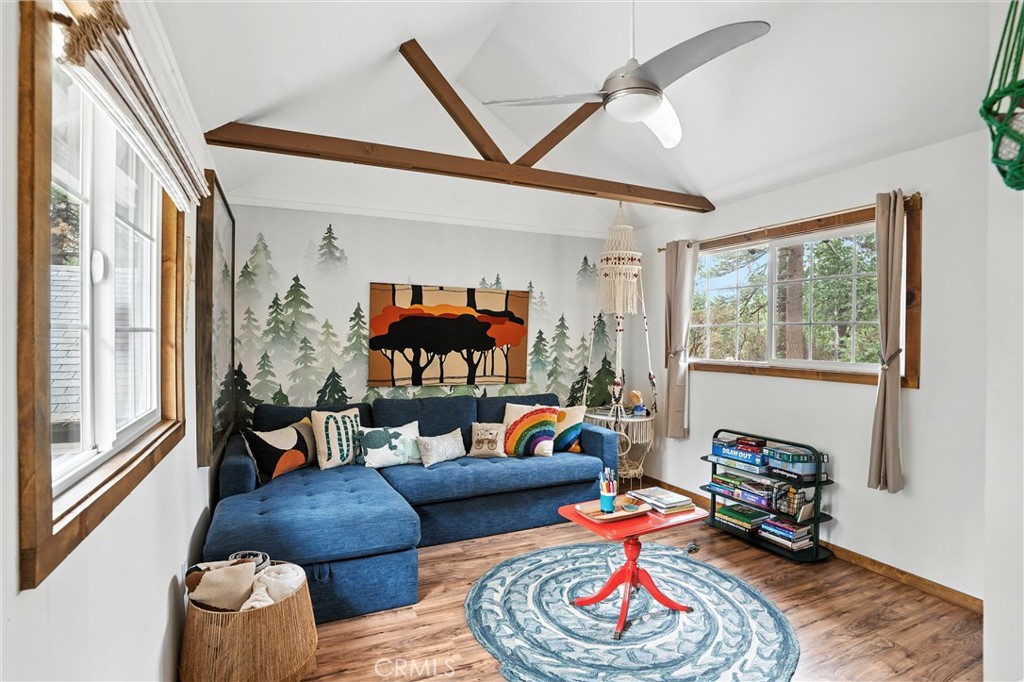 24990 Marion Ridge Drive Idyllwild, CA 92549 - Photo 10 of 41 a living room with furniture and a floor to ceiling window