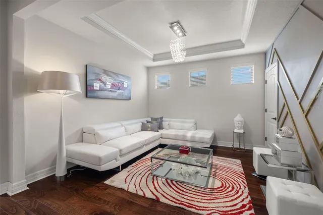 a living room with furniture and a rug