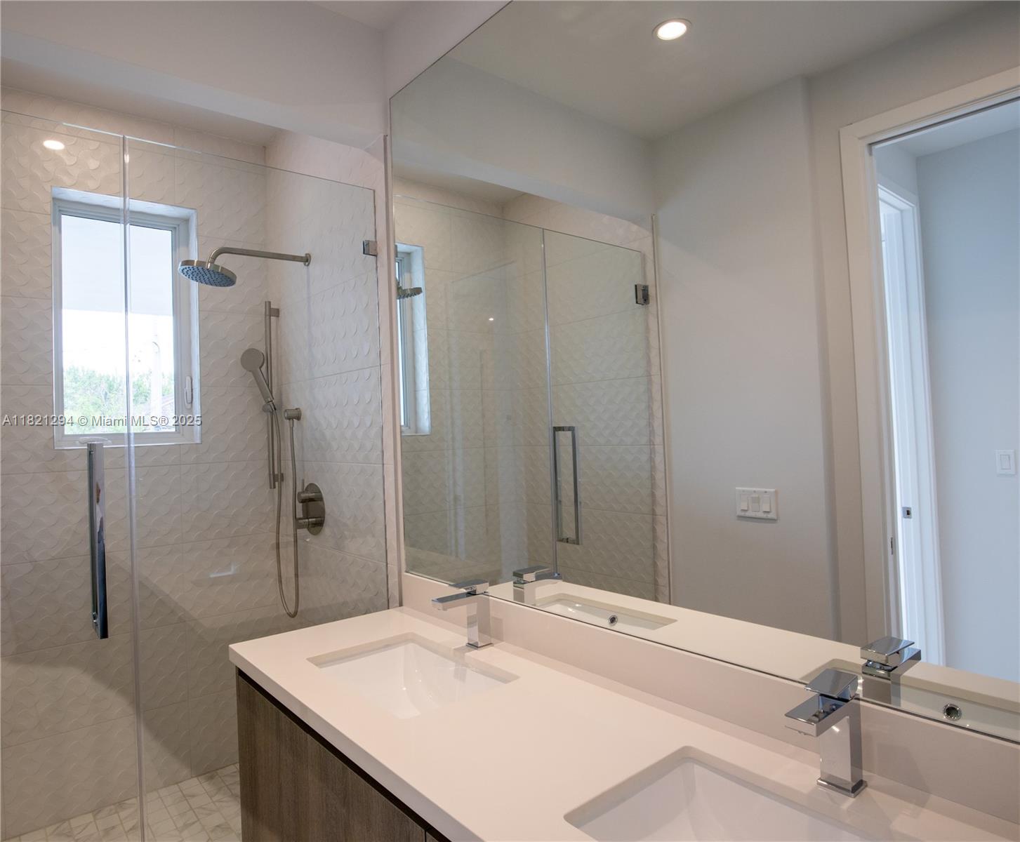 3374 Day Avenue, Unit A Miami, FL 33133 - Photo 9 of 13 a bathroom with a sink and a mirror