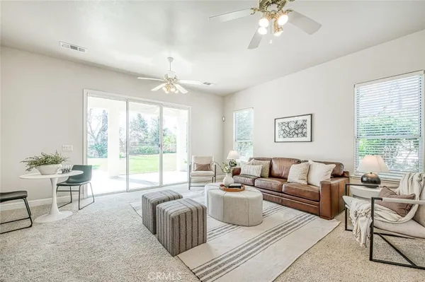a living room with furniture and a large window