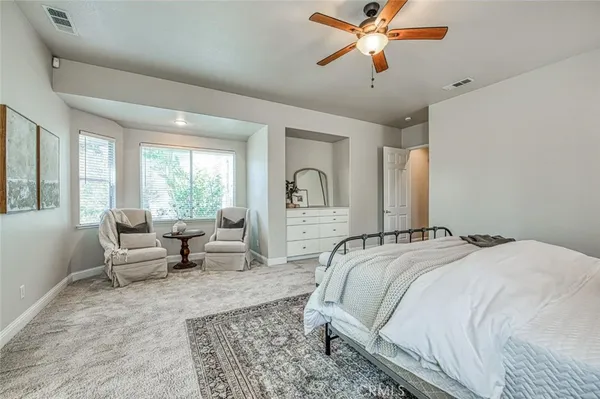 a bedroom with bed and window